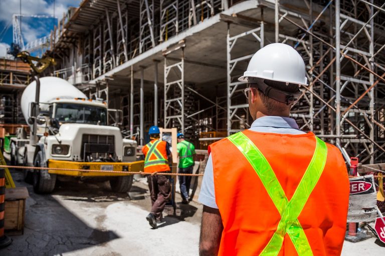 A group of construction workers on a job site financed with the help of working capital loans