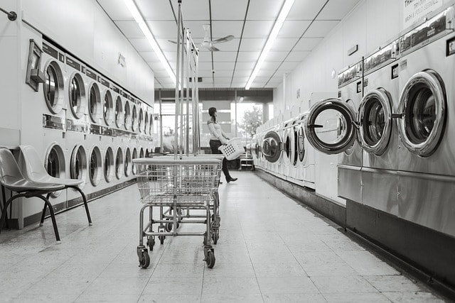 How to Buy a Laundromat with No Money Down - laundry saloon, laundry, person, washing machines